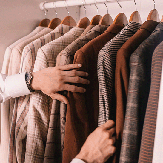 A man going through his dressing and his delicate suits